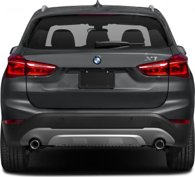 Rear view showing tail lights, dual exhausts, and rear windshield wiper.