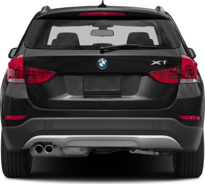 Rear view with signature taillights and dual exhaust pipes