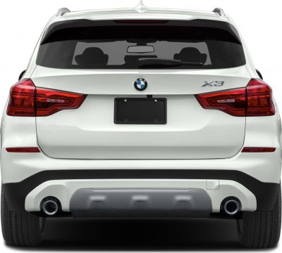 Rear view showing signature BMW taillights and dual exhaust outlets