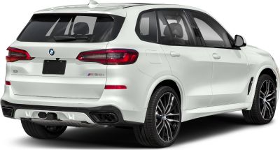 Rear-side view of white SUV with quad exhaust and LED taillights