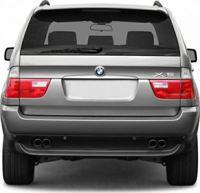 Silver SUV rear with quad exhaust tips and signature taillights