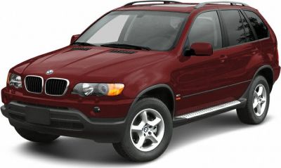 Front-side view of a red SUV with distinct grille and alloy wheels