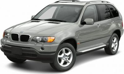 Silver luxury SUV with kidney grille and side steps