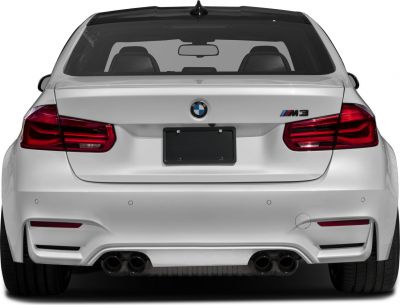 Rear end with quad exhaust and distinct taillights.