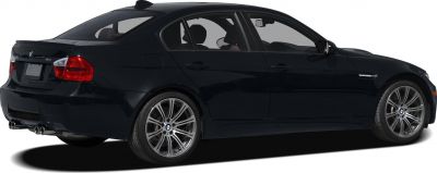 Rear side view of black sedan with alloy wheels and quad exhaust