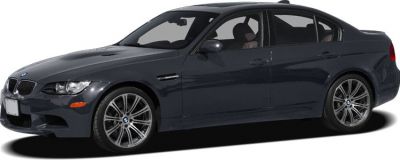 Dark gray four-door sedan front side view with sporty alloy wheels