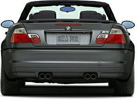 Rear view with quad exhaust and wide tires