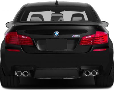 Rear view with quad exhausts and distinctive taillights