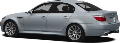 Side profile of silver BMW M5 with alloy wheels and quad exhaust