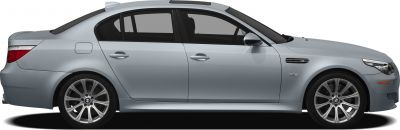 Silver four-door sedan side view with sporty alloy wheels.
