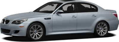 Silver sedan side profile with sporty alloy wheels and aerodynamic design.
