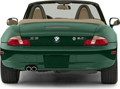 Rear view of convertible with dual exhaust and emblem details