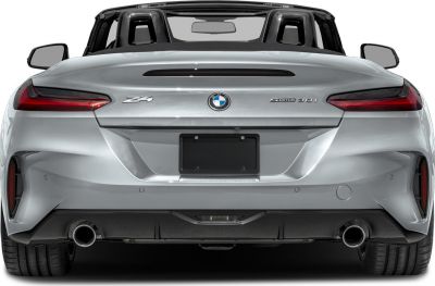 Rear view of a sleek convertible with dual exhaust and modern taillights