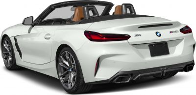 Rear view of a white convertible with dual exhaust and sporty design.