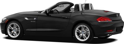 Side view of a black convertible roadster with silver sport wheels and roll bars