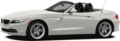 Side view of white convertible roadster with sport design