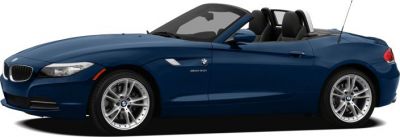 Side profile of a blue convertible with sporty alloy wheels and aerodynamic design