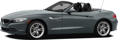 Side profile of a sleek convertible roadster with retractable hardtop and alloy wheels