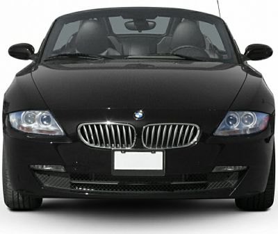 Front view of black convertible with kidney grille and dual headlights