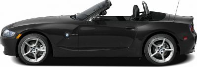 Black convertible roadster with sporty alloy wheels, side profile view