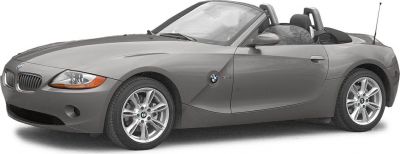 Front-side view of a convertible sports roadster with alloy wheels and side mirrors