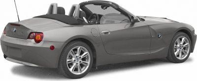 Rear side view of a convertible roadster with alloy wheels and open roof