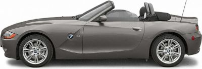 Side profile of a two-door convertible roadster with alloy wheels.