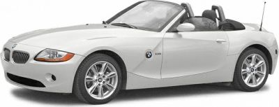 White convertible roadster with open roof and alloy wheels