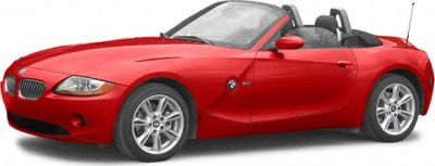 Red convertible roadster with sporty alloy wheels and open roof