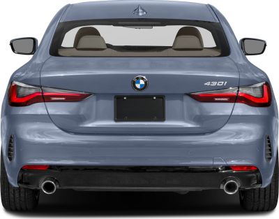 Rear view with tail lights, dual exhausts, trunk, rear window with shark fin antenna