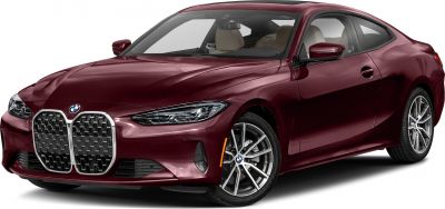 Front kidney grille and sleek headlights of a two-door coupe with alloy wheels