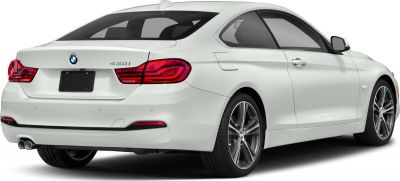 Rear three-quarter view of coupe with dual exhaust and distinctive taillights