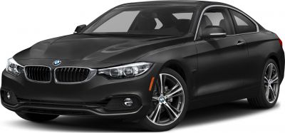 Black coupe with LED headlights and alloy wheels, sporty aerodynamic design