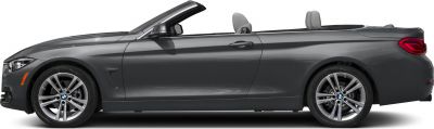 Side profile of convertible with open soft top and alloy wheels