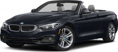 Convertible car with open roof, distinctive front grille, headlights, and alloy wheels