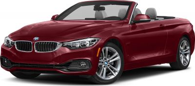 Red convertible with sleek headlights and alloy wheels
