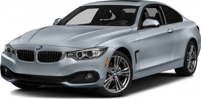 Silver luxury coupe with distinctive headlights and alloy wheels