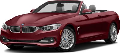 Front side view of red convertible with alloy wheels and sleek headlights