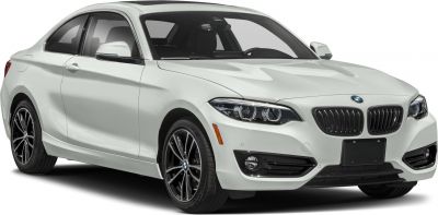 White coupe with black grille and alloy wheels front-side view