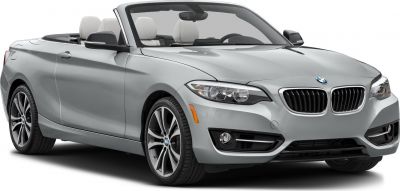 Front view of a convertible with grille, headlights, and alloy wheels.