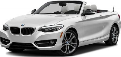 Front side view of a white convertible car with headlights and alloy wheels