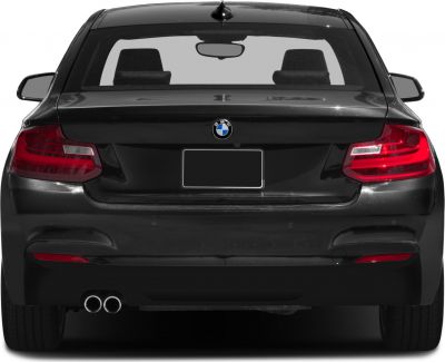 Rear view featuring taillights and dual exhaust of a sporty coupe.
