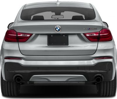 Rear view of silver SUV with dual exhaust and distinct tail lights