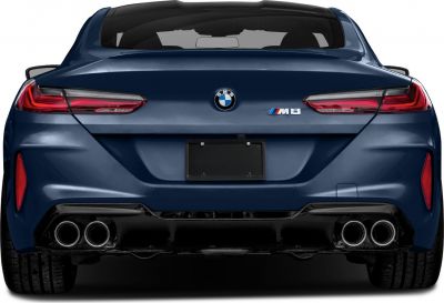Rear view of a sporty coupe with quad exhaust tips