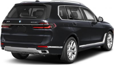Rear and side view featuring tail lights, dual exhaust, and alloy wheels.