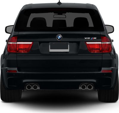 Rear view of a luxury SUV with quad exhaust and prominent taillights