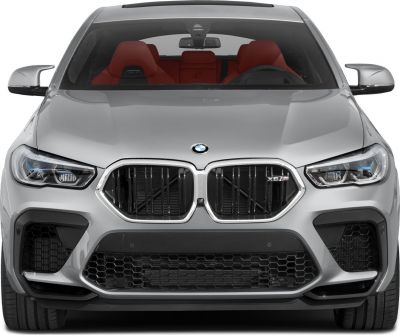 Aggressive front view with kidney grille and red sporty interior seats.