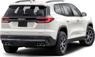 Rear view of modern SUV with quad exhausts and tinted windows