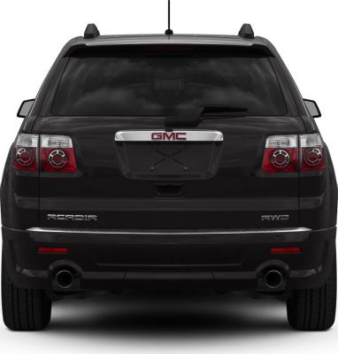 Rear view with dual exhaust, roof rails, tinted rear window, and rear windshield wiper