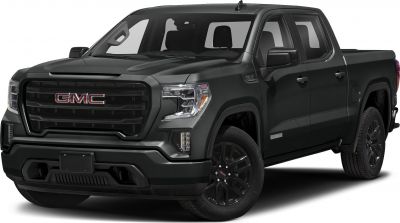 Black pickup truck with distinctive grille and headlights, front-side angle
